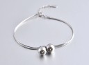 Bracelet féminin avec grelots H420 1
