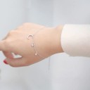 Bracelet féminin avec lune et étoiles 2