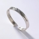 Bracelet ouvert en plume pour femme 3
