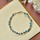 Bracelet rigide pour femme avec perles H167 1