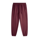 Calças de treino unisex de cor sólida com cintura elástica e cordões ajustáveis, complementadas com bolsos laterais e punhos 19