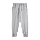 Calças de treino unisex de cor sólida com cintura elástica e cordões ajustáveis, complementadas com bolsos laterais e punhos 18