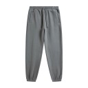 Calças de treino unisex de cor sólida com cintura elástica e cordões ajustáveis, complementadas com bolsos laterais e punhos 15