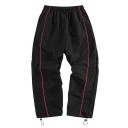 Calças largas para homem com cintura elástica e cordão ajustável nas pernas, complementadas com um lampasso contrastante de lado e bolsos laterais 2