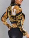 Camicia da donna con motivo leopardato e ornamenti dorati Strisce nere e pannelli bianchi Maniche lunghe con polsini Colletto classico Chiusura 5