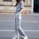 Camicia e pantaloni a righe da donna 3