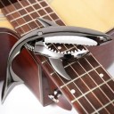Cápa alakú gitár capo 11x10,8 cm cink ötvözet galvanizált semleges színek tárolótáskával akusztikus és elektromos gitárhoz 4