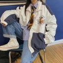 Casaco oversized feminino com fecho de correr Branco com partes em azul escuro Com gola alta Motivo redondo no peito Punhos e bainha ajustados 2