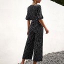 Dame jumpsuit med polkaprikker og flæser 1