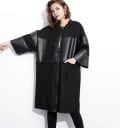 Dame lang jakke med brede trekvartærmer Løs pasform med lynlås og lommer Ribbet krave Sort kombination af bomuld og kunstlæder 1