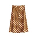 Dame midi nederdel med hvide prikker A-formet snit Række af knapper foran Skrå sidelommer Brun farve Polyester Længde under knæene 1