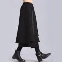 Damen lange schwarze Schichtrock mit asymmetrischem Schnitt und Schlitz Dekorative hängende Bänder Vordertasche Elastischer Gummibund Baumwolle 3