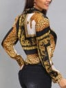 Damesblouse met luipaardprint en gouden ornamenten Zwarte strepen en witte panelen Lange mouwen met manchetten Klassieke kraag Knopen sluiting 5