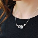 Damesketting met bloem op tak A1605 1