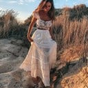 Dámska biela maxi sukňa s krajkovými vsadkami Pas so šnúrkou a strapcami Predné kapsy Vrstvený volánový strih Bavlna a polyester 2
