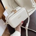 Dámska crossbody kabelka v tvare krabičky Zapínanie na zips Kovové nožičky Nastaviteľný popruh s karabínkami PU koža 17 x 10 x 8,5 cm 6