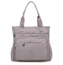 Dámská kabelka přes rameno z nylonu a polyesteru 38 x 38 x 12 cm Prostorná taška se dvěma uchy Přední kapsy na zip Boční kapsy 4