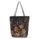 Damska torba płócienna z kwiatowym nadrukiem Przestronny shopper z dwoma szarymi uchwytami i prostym dnem 27 x 38 x 11 cm Płótno i poliester 9
