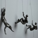 Dekorativ statue af en klatrer 1