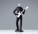 Dekorativ statue af en musiker 1