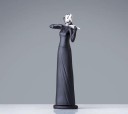 Dekorativ statue af en musiker 2