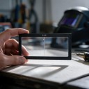 Dioptrische loep voor lashelm 2,25 dioptrie Afmeting 11 x 5,5 cm Dikte 3 mm Glas Zwarte rand Voor nauwkeurig lassen 4