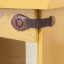 Dispositif de sécurité pour tiroirs et portes de placard 5 pcs Corps en plastique avec bouton Sangle flexible autour du coin des meubles 2