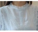 Elegant blus för damer med långa lösa ärmar och spetsdekoration Rund halsringning Rynkade manschetter med volang Polyester och spandex 5