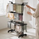 Estante para secar roupa 63,5 x 125,5 x 173 cm com 4 níveis e asas dobráveis, estante móvel preta para roupas com suportes para cabides 2