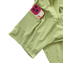 Falda deportiva corta para mujer de color sólido con lazo y bolsillos de nylon, material funcional ligero, falda con pantalones cortos 2