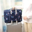 Foldable travel bag with print for holidays and trips With a front zip pocket On suitcase handle Made of nylon Dimensions 47 x 33 x 16 cm 11