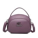 Geantă crossbody pentru femei, cu formă rotundă, mâner superior și curea. Mai multe compartimente cu fermoar. Piele PU texturată. 21 x 17 3