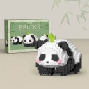 Gyerekeknek szánt aranyos panda alakú építőjáték, amely fekvő helyzetben van, és egy kis zöld levél díszíti a fejét, 556 darabos kirakós, kreatív 2