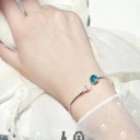Kvinnors öppet armband med en boll 4