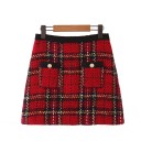 Ladies' A-line mini skirt with a red check pattern Two front pockets with gold buttons Structured fabric Cotton and polyester 1