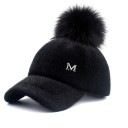 Ladies' cap with a large pom-pom made of artificial fur Fluffy surface made of acrylic Quilted rounded visor Head circumference 56 to 60 cm 1