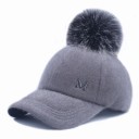 Ladies' cap with a large pom-pom made of artificial fur Fluffy surface made of acrylic Quilted rounded visor Head circumference 56 to 60 cm 2