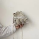 Ladies' crossbody bag in pouch shape Woven checkered pattern Decorative tassels Cord strap across the shoulder Boho style Polyester 20 x 18 x 5
