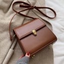 Ladies' crossbody handbag made of PU leather Square shape with flap Metal fastening Adjustable strap with carabiners Dimensions 18.5 x 18.5 x 2