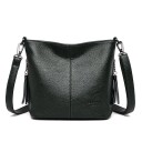 Ladies' crossbody handbag made of synthetic leather Textured surface Shoulder strap with metal carabiners Decorative tassels on a chain 6