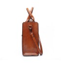 Ladies' handbag for hand and shoulder Spacious bag made of synthetic leather with a glossy surface Two handles and adjustable strap 33 x 28 x 7