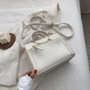 Ladies' handbag for hand or shoulder carry made of artificial leather Round handles with a gold metal arch Front zip pocket 23.5 x 17 x 10 cm 3