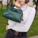 Ladies' handbag with a large bow for hand or shoulder carry Eco-leather Adjustable strap Zip fastening 23 x 15 x 7.5 cm Gold hardware 12