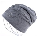 Ladies' knitted cap with floral gemstone motif Loose extended fit Double-layered with gathered back Cotton and acrylic 3