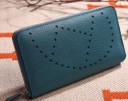 Ladies' long zip-around wallet made of genuine leather Grained surface with decorative perforation Flat shape for handbag 20 x 10.5 x 2.5 5