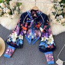Ladies' set blouse and shorts Floral pattern on a dark blue background Blouse with a bow at the neck Balloon sleeves with high cuffs Polyester 3