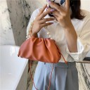 Ladies' small handbag with a gathered soft shape and decorative pearl handle Long thin strap across the shoulder Artificial leather 25 x 12