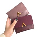 Ladies' small wallet with a suede-look flap and a gold embellishment in the shape of a V Quilted front made of PU leather Dimensions 11.5 x 9 7