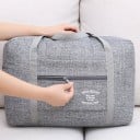 Matkalaukku olkahihnalla ja matkalaukun kahvaan liu'utettavalla osalla Etutasku vetoketjulla Kaksi pitkää kahvaa Melange-nylon 40 x 13 5
