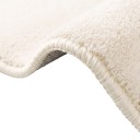 Minimalista szőnyeg, szabálytalan forma, dombornyomott ívek mintázattal, 230 x 160 cm, poliészter, krémes bézs, hullámos szélekkel 5